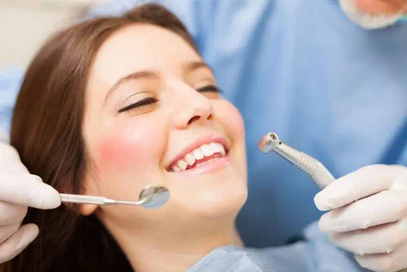 A patient smiling during a dental visit